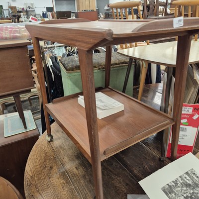 Lot 2597 - A retro teak drinks trolley.