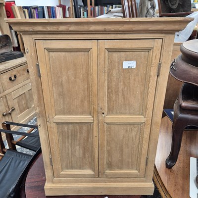 Lot 2601 - A small pine two-door cabinet.