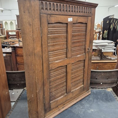 Lot 2668 - An oak corner cabinet.