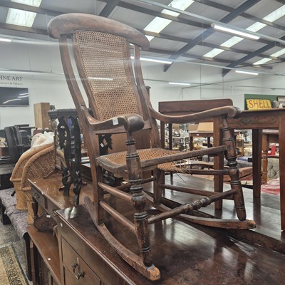 Lot 2702 - An antique rocking chair.