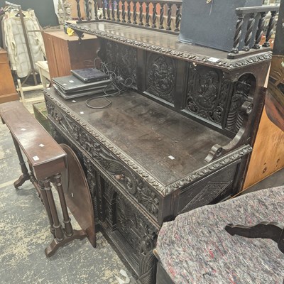 Lot 2709 - A carved oak hall cabinet.