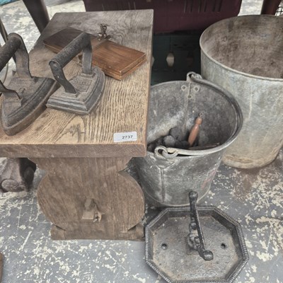 Lot 2737 - A boot scraper, two fire buckets, two flat...