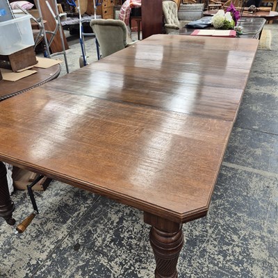 Lot 2754 - A large Victorian wind out dining table. With...