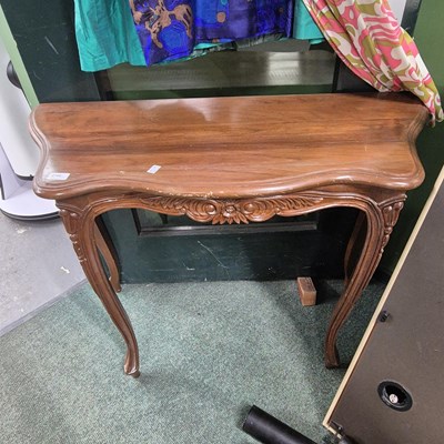 Lot 2766 - A pair of hardwood serpentine side tables.