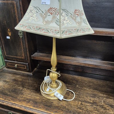 Lot 2772 - A gilded table lamp.