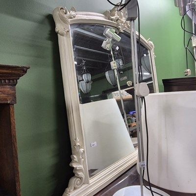 Lot 2827 - An oval mantle mirror.
