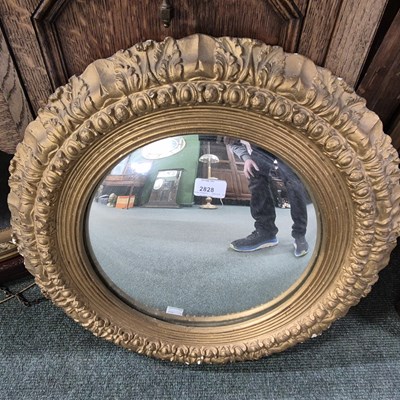 Lot 2828 - A gilt-framed convex mirror.