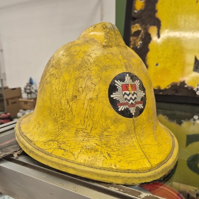 Lot 1394a - A vintage fireman's helmet.