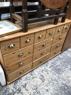 Lot 2672 - A pine multi-drawer merchants chest 133 x 41 x...