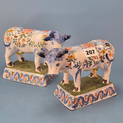 Lot 207 - A pair of 19th century polychrome Delft cows,...