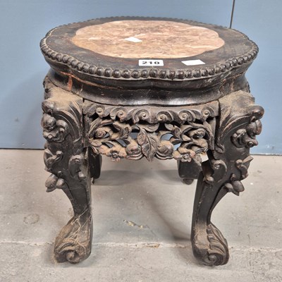 Lot 210 - A Chinese marble topped hardwood stand, the...