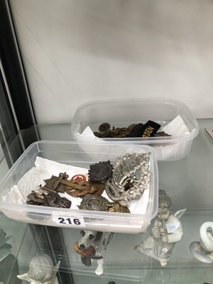Lot 216 - Military cap badges, buttons, etc.