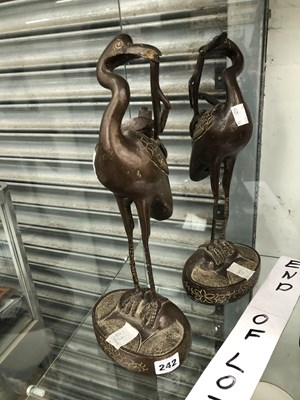 Lot 242 - A pair of Japanese bronze standing cranes.