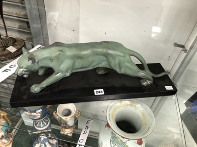 Lot 243 - An Art Deco cast metal sculpture of a green...