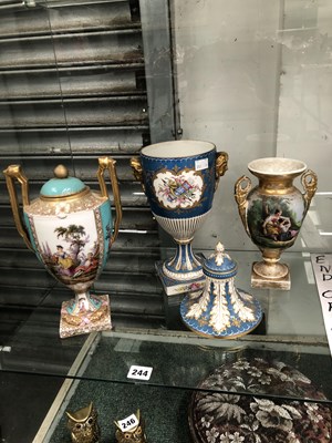 Lot 244 - Three continental porcelain hand-painted urns.