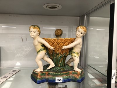 Lot 255 - A Majolica centrepiece supported by three...
