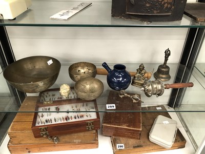 Lot 289 - A Buddhist prayer wheel, three singing bowls,...