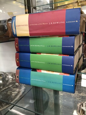 Lot 304 - A collection of four Harry Potter books to...