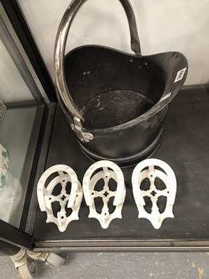 Lot 360 - A coal bucket and three decorative horseshoe...