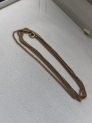 Lot 4 - A long gold pendant chain, unhallmarked, the...
