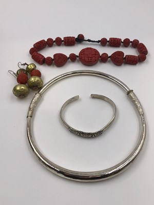 Lot 26 - A Chinese silver torque bangle, stamped 999, a...