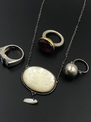 Lot 41 - A Chinese mother-of-pearl carved panel pendant...