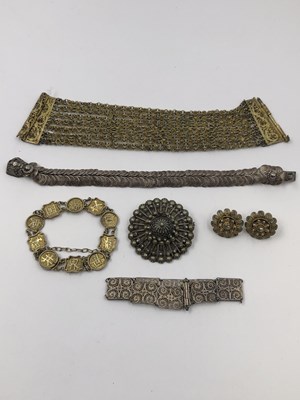 Lot 42 - A Chinese silver gilt character panel bracelet...