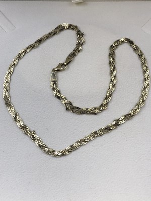 Lot 46 - A twisted neck chain and a single earring....
