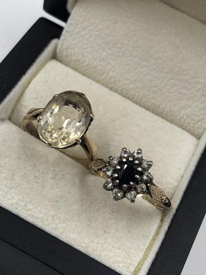 Lot 58 - A lemon oval gemset ring, unhallmarked,...