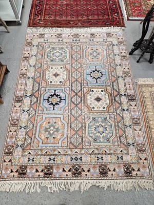 Lot 664 - An Oriental rug of unusual design. 157 x 211cms