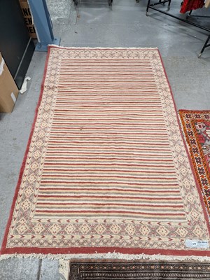 Lot 678 - An Oriental rug of unusual design