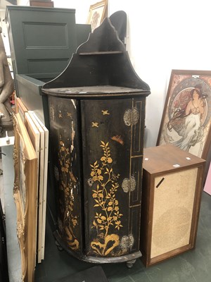 Lot 672 - A black ground bow fronted corner cupboard the...