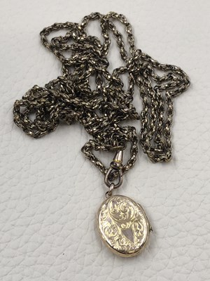 Lot 72 - A 9ct Chester hallmarked oval locket on a...