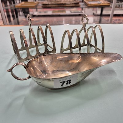 Lot 78 - Hallmarked silver- Two toast racks and a sauce...