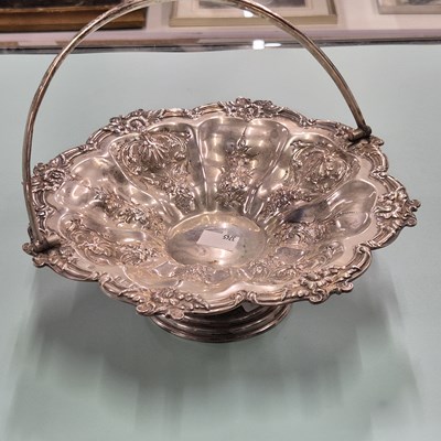 Lot 80 - A hallmarked silver swing handle ornate basket....