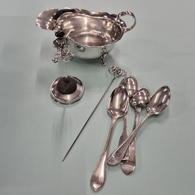 Lot 83 - Hallmarked silver- a sauce boat, four spoons,...