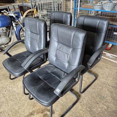 Lot 772 - a set of four modern office chairs.
