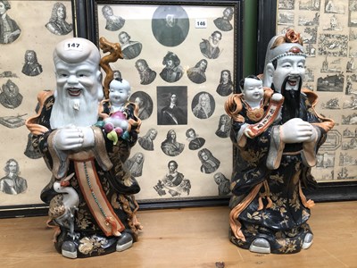 Lot 147 - A pair of Chinese immortal figures.