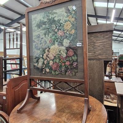 Lot 1189 - A mahogany framed floral woolwork fire screen