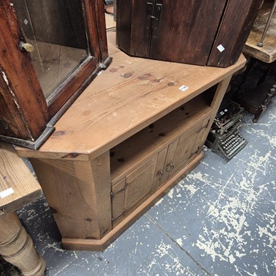 Lot 1196 - A pine sound system table with an open shelf...