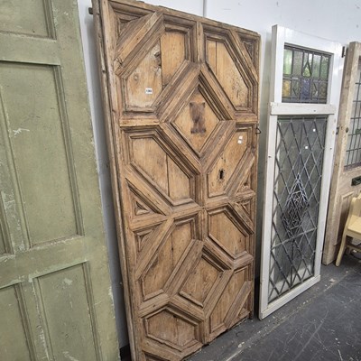 Lot 1365 - An early geometric panelled pine door. 193 x...
