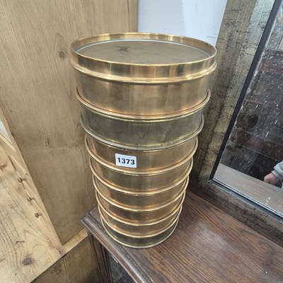 Lot 1373 - A tower of scientific sieves and a lamp.