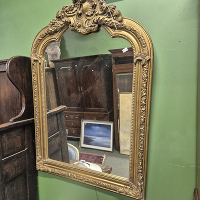Lot 1486 - A gilt framed antique style wall mirror.