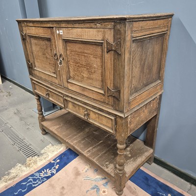 Lot 356 - A 19th century oak cabinet of two doors over...
