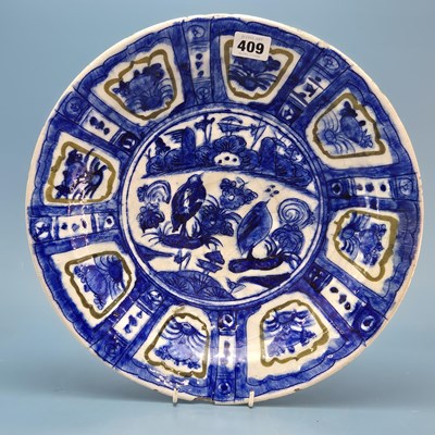 Lot 409 - A 17th century Iranian stoneware blue and...