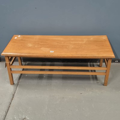 Lot 114 - A 1970s ash and oak coffee table, the tapering...