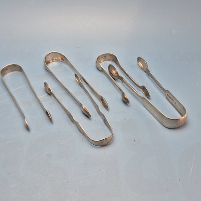 Lot 124 - Three George III Hallmarked silver sugar tongs...