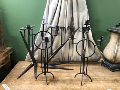 Lot 5 - Two pairs of wrought iron candelabra, one pair...