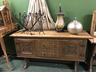 Lot 7 - An Arts and Crafts oak sideboard, the central...