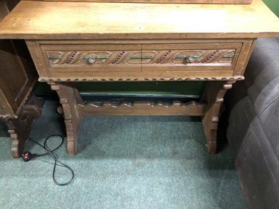 Lot 9 - An Arts and Crafts oak side table, the two...